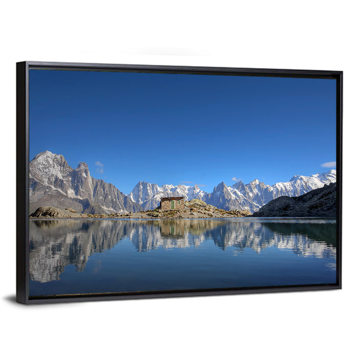 Stone Cabin on Mountain Lake Wall Art as a framed canvas