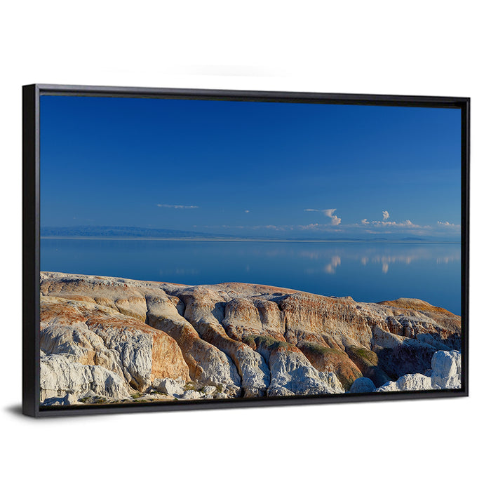 Shekelmes Tract Cliff Over Lake Wall Art as a framed canvas