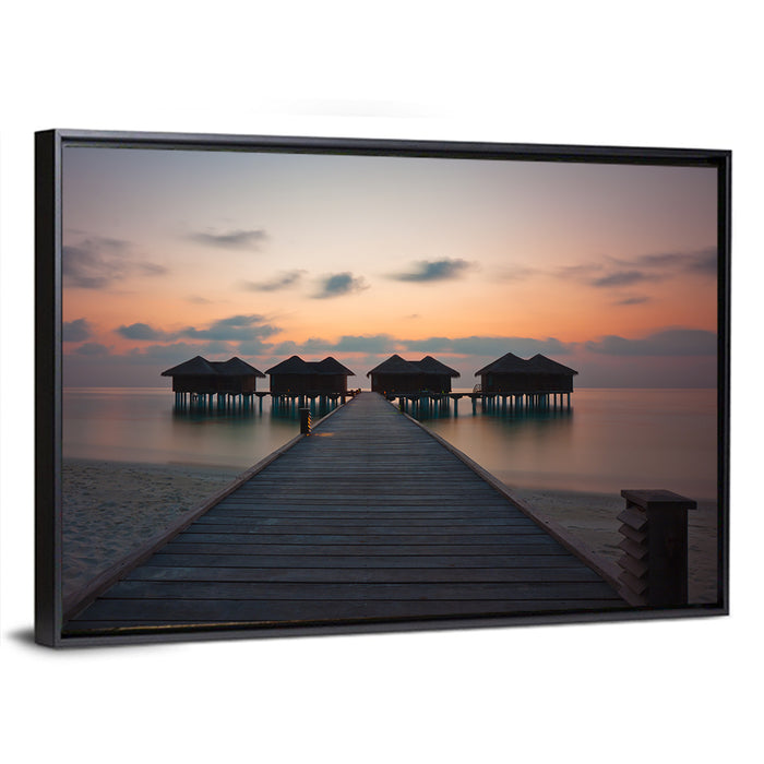 Overwater Bungalows at Sunset Wall Art as a framed canvas