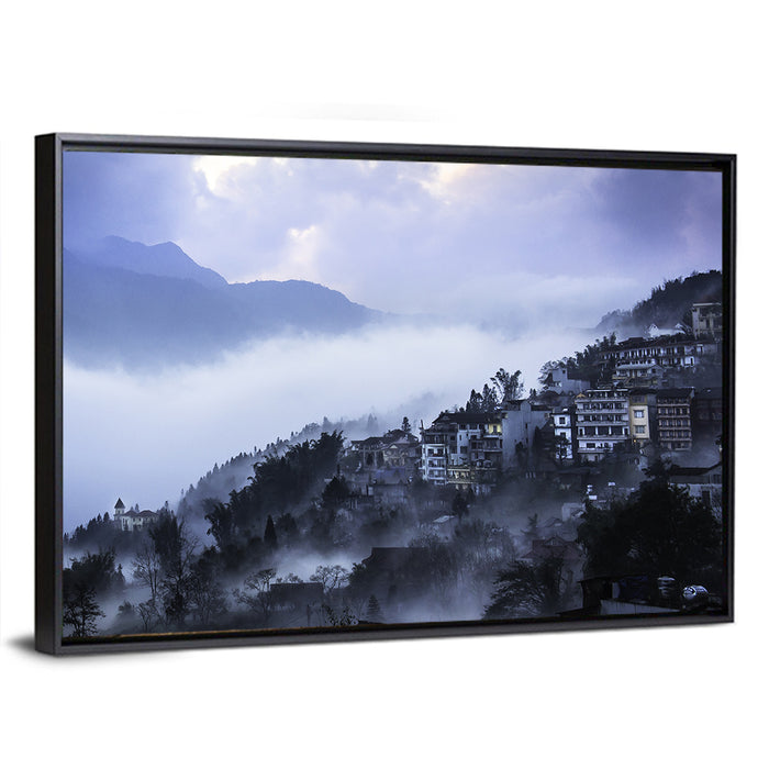 Misty Hillside Town Wall Art as a framed canvas