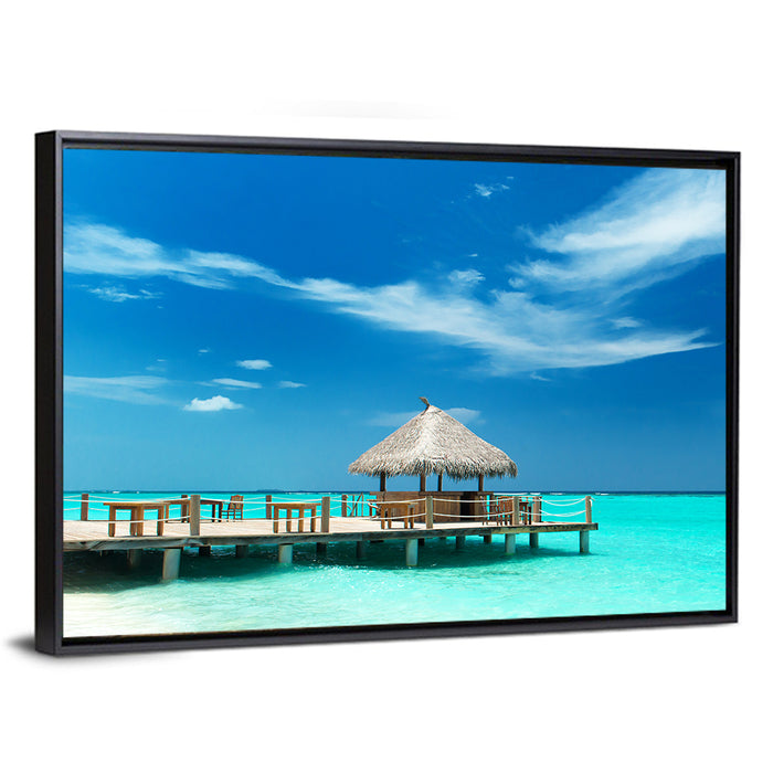 Thatched Beach Bar Pier Wall Art as a framed canvas