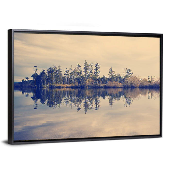 Sunset Over Forest Lake Wall Art as a framed canvas