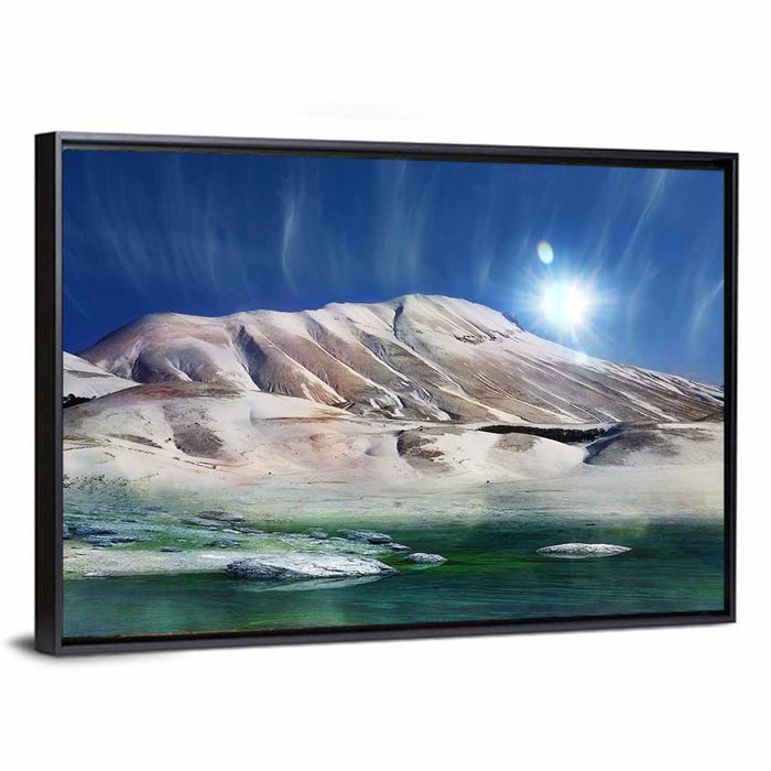 Sunburst Over Winter Mountain Wall Art as a framed canvas