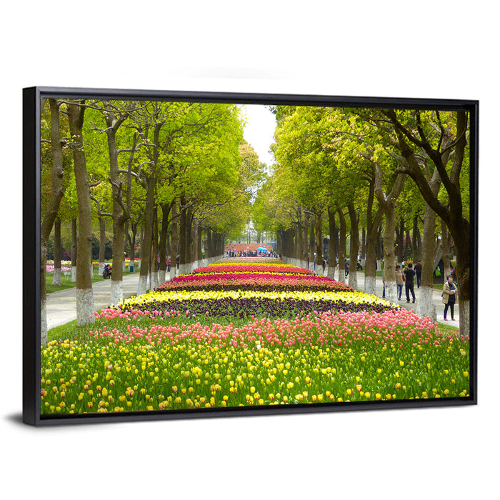 Tree-lined Tulip Garden Path Wall Art as a framed canvas
