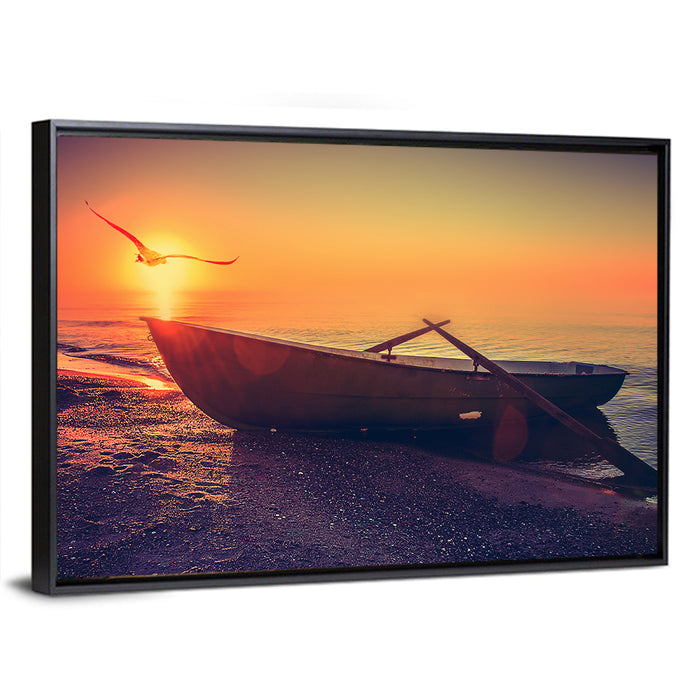 Sunset Rowboat on Sandy Shore Wall Art as a framed canvas