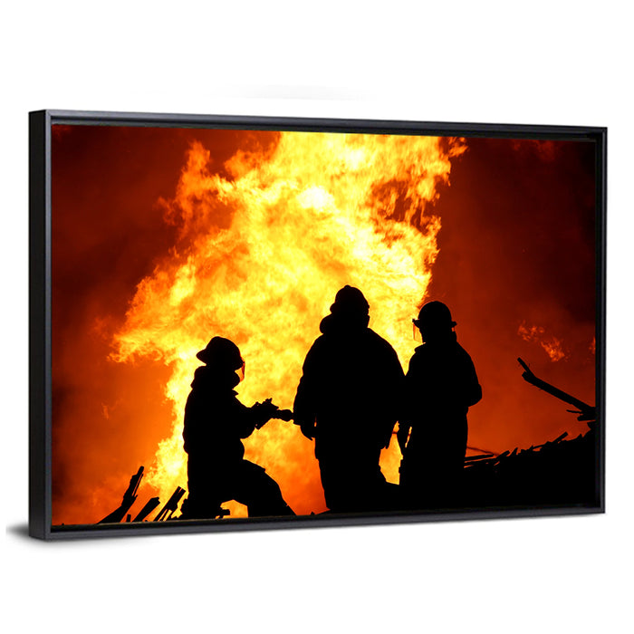 Firefighters Silhouetted Against Flames Wall Art as a framed canvas