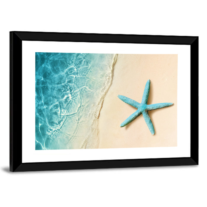 Blue Starfish on Sandy Beach Wall Art as a framed print