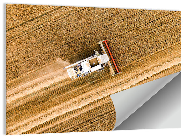 Aerial Combine Over Wheat Field Wall Art as a poster print