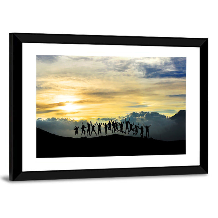 Golden Team Silhouettes at Sunset Wall Art as a framed print