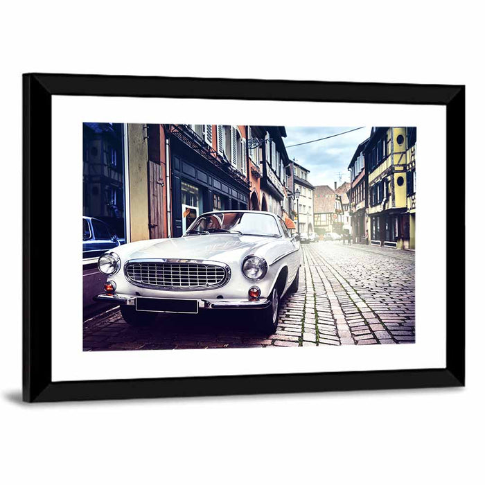 Vintage Car on Cobblestone Street Wall Art as a framed print