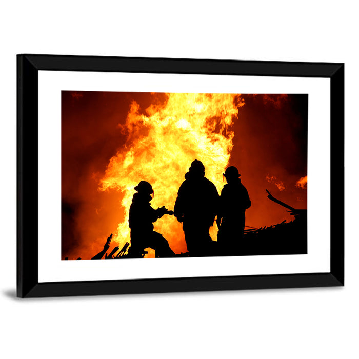 Firefighters Silhouetted Against Flames Wall Art as a framed print