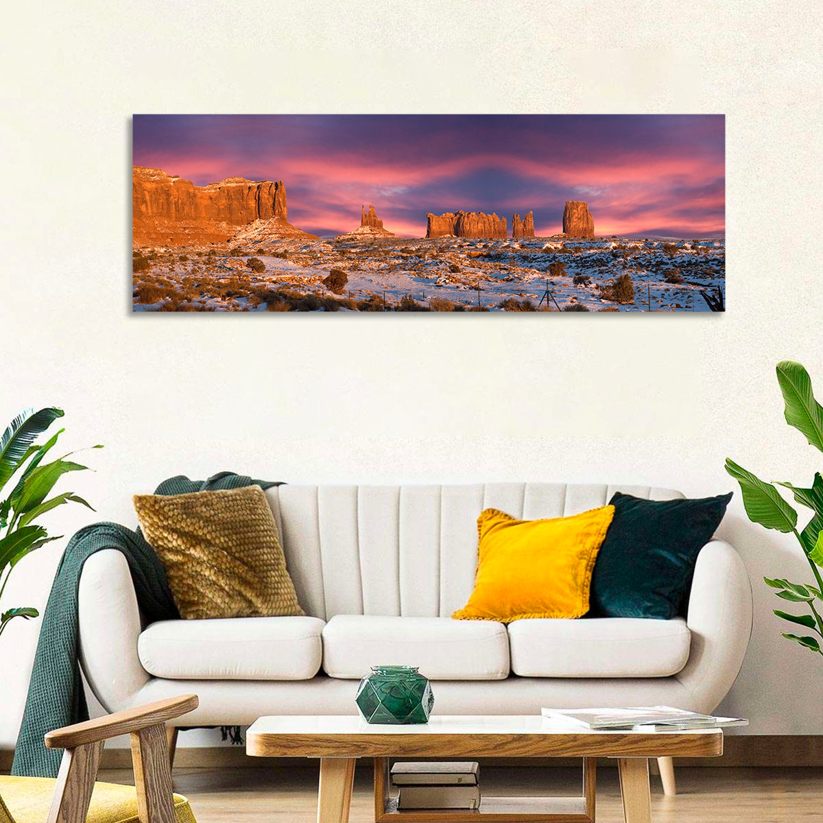 Snow-dusted Monument Valley Sunset Wall Art in a room, panoramic
