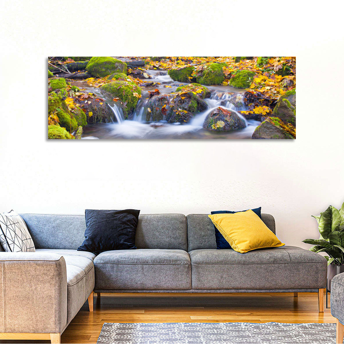 Mossy Autumn Stream Wall Art in a room, panoramic