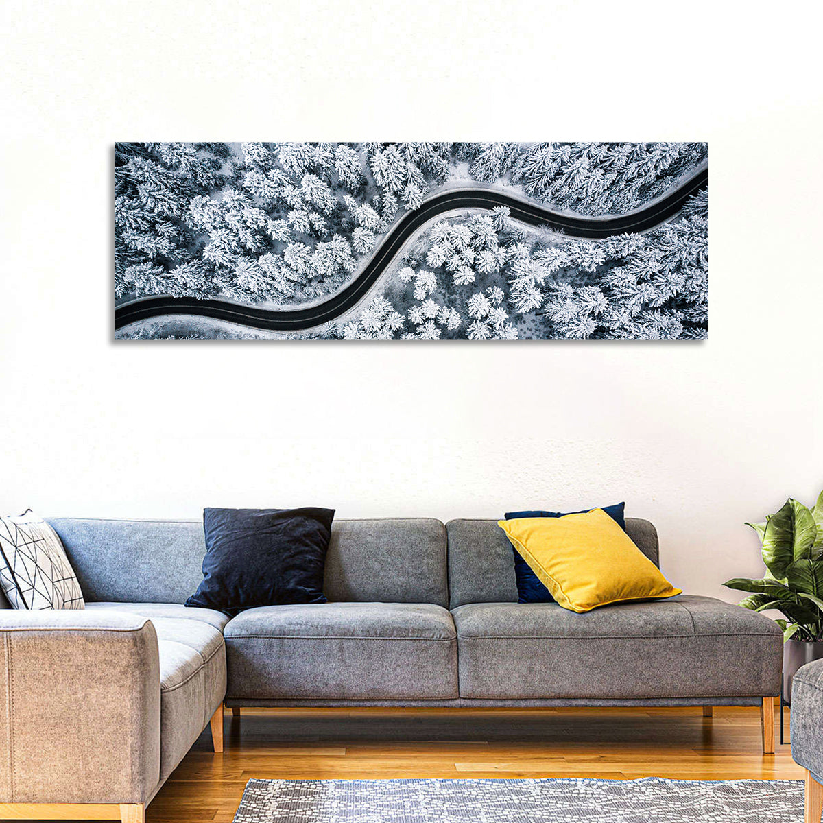 S-curve Winter Forest Road Wall Art in a room, panoramic