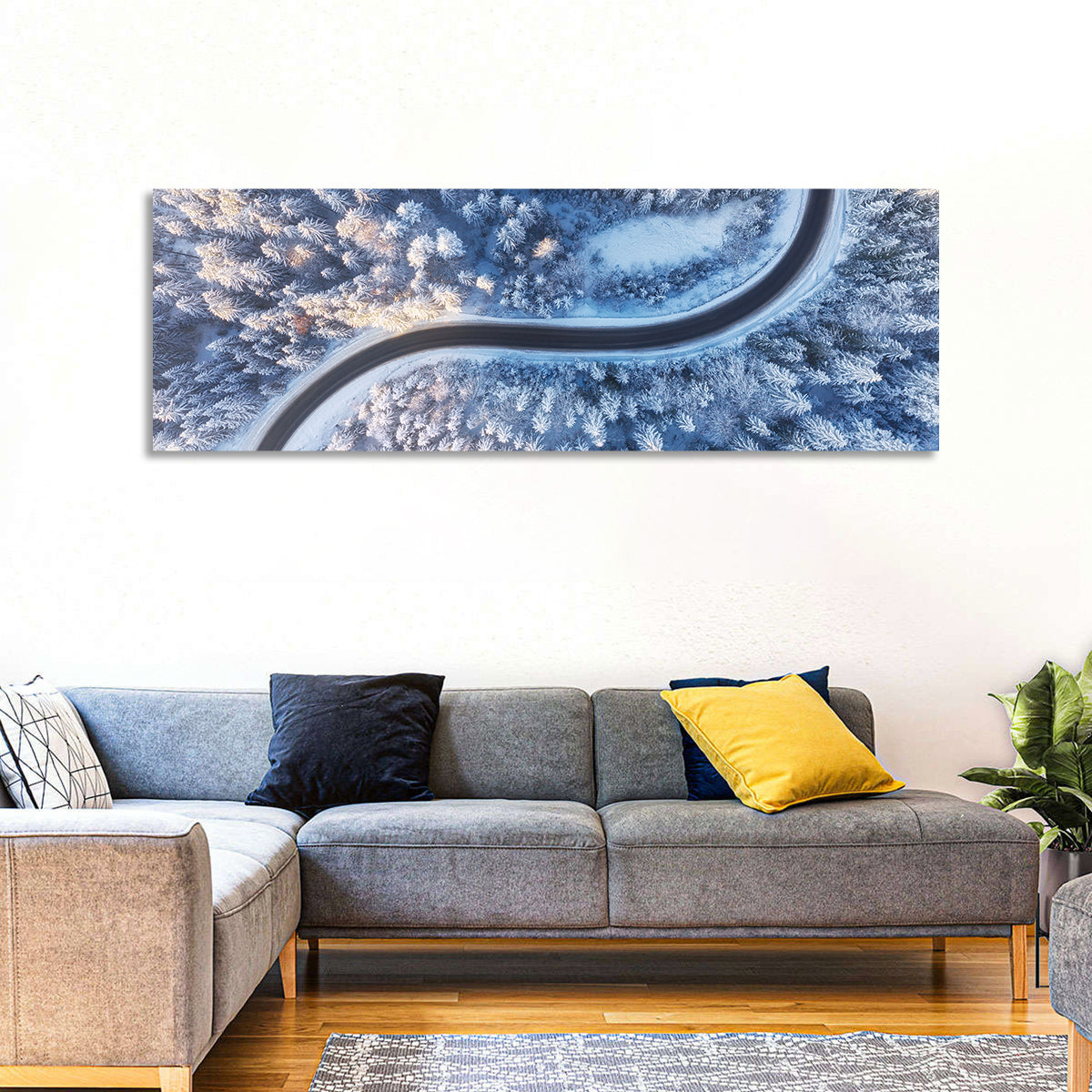Winding Snow-covered Forest Road Wall Art in a room, panoramic