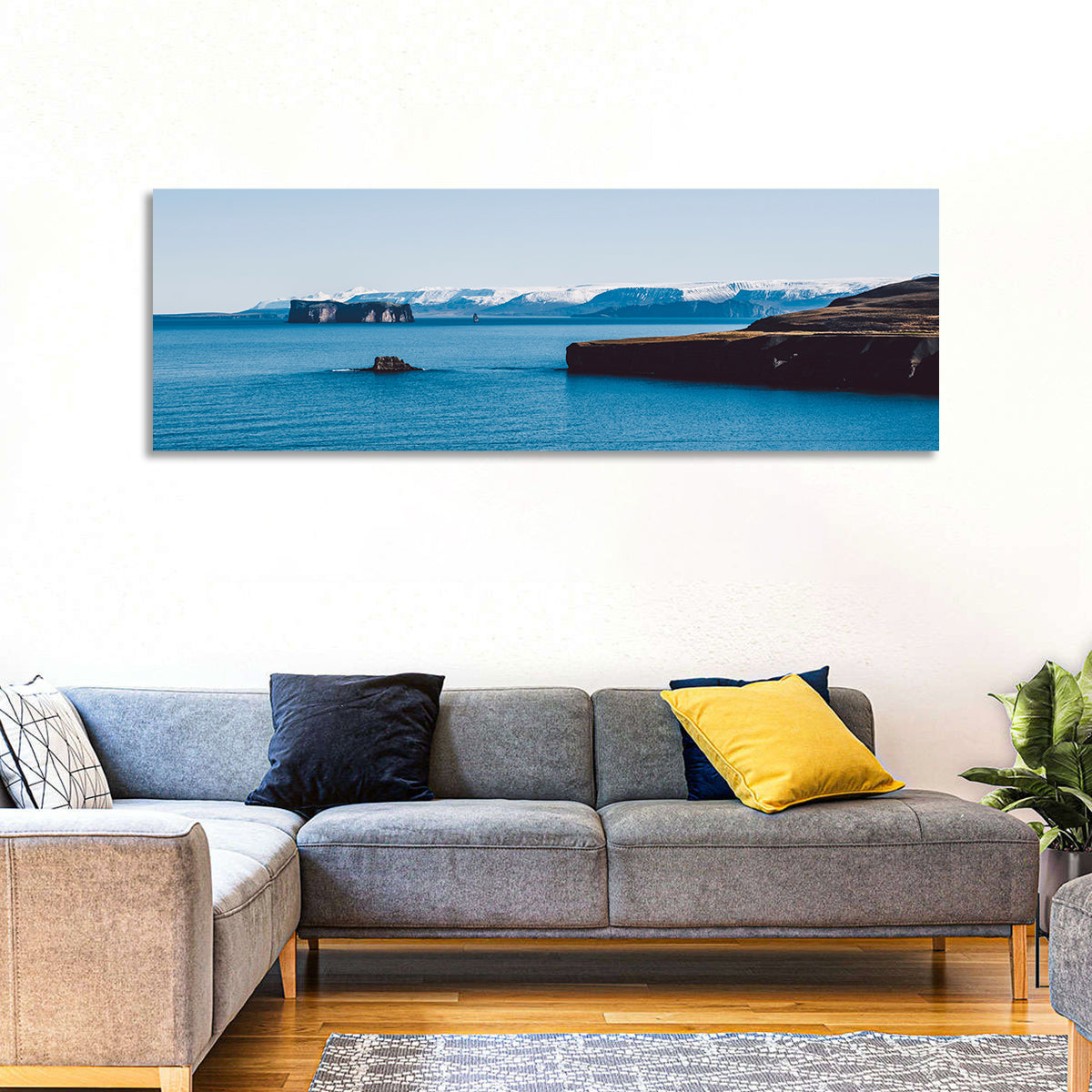 Calm Blue Lake with Coastal Cliffs Wall Art in a room, panoramic