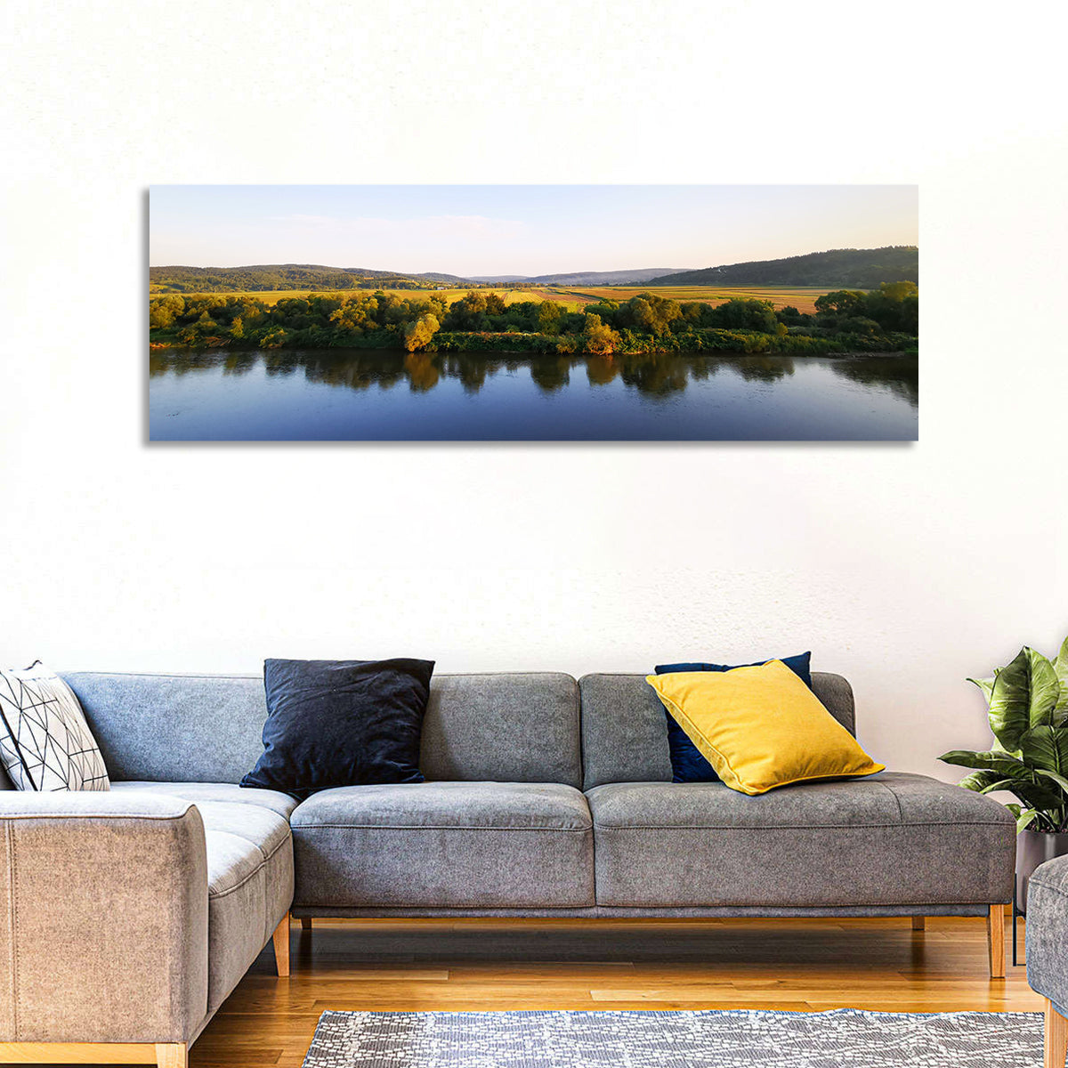 Peaceful River Sunset Wall Art in a room, panoramic