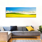 Rapeseed Field and Rolling Hills Under Blue Sky Wall Art