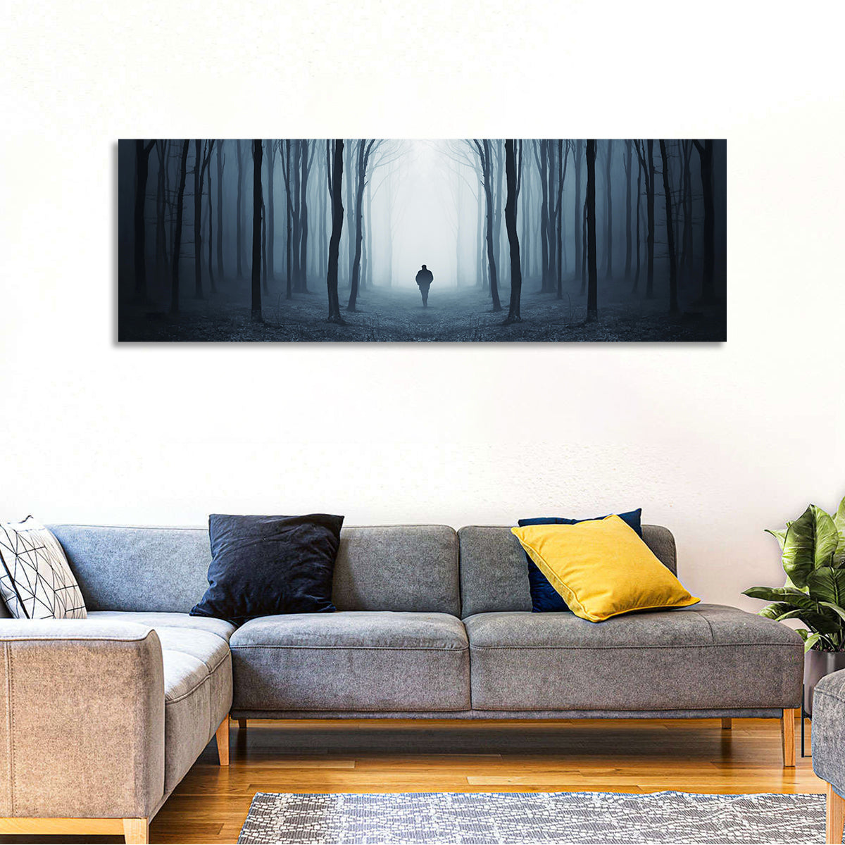Lone Figure in Misty Forest Wall Art in a room, panoramic