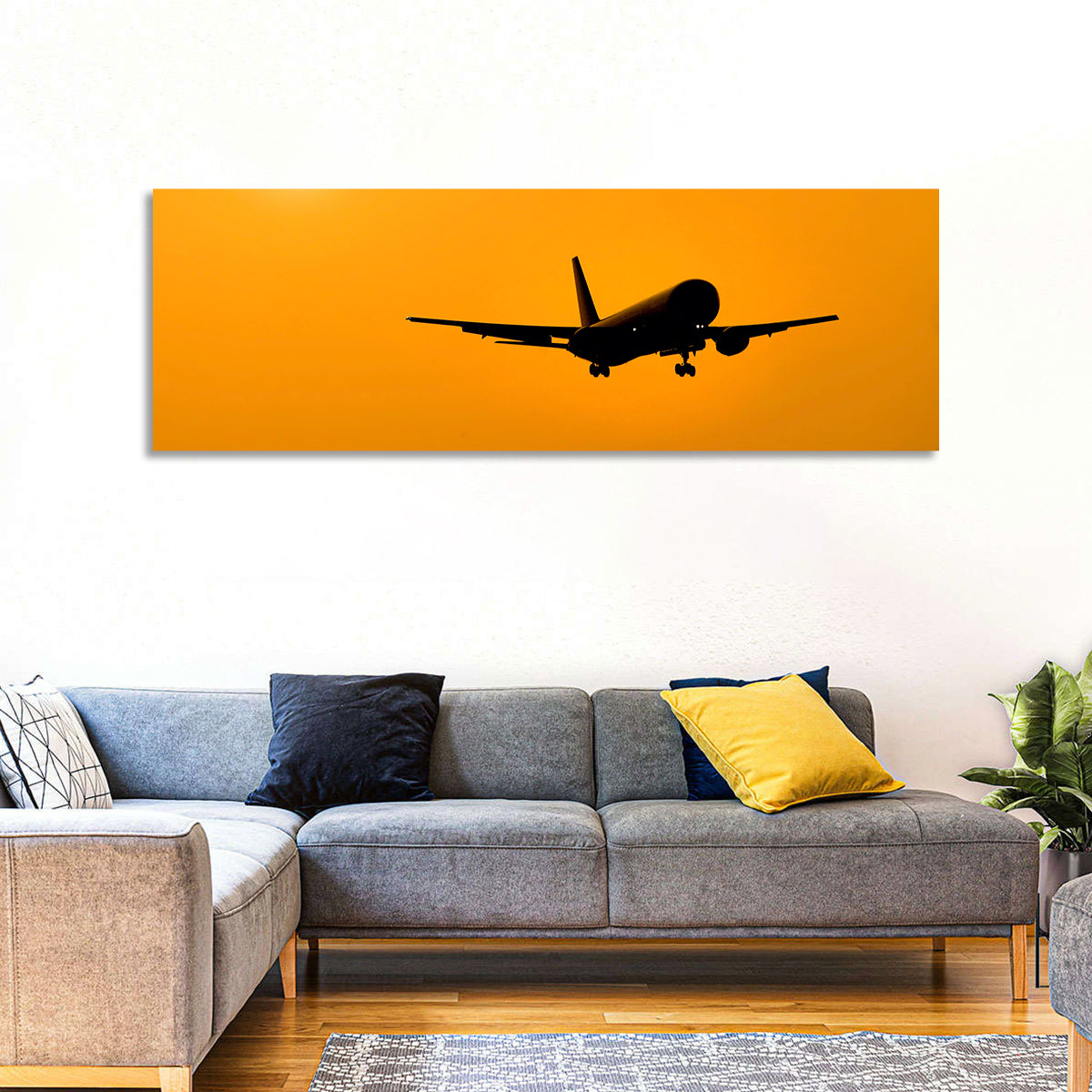Golden Hour Airliner Silhouette Wall Art in a room, panoramic