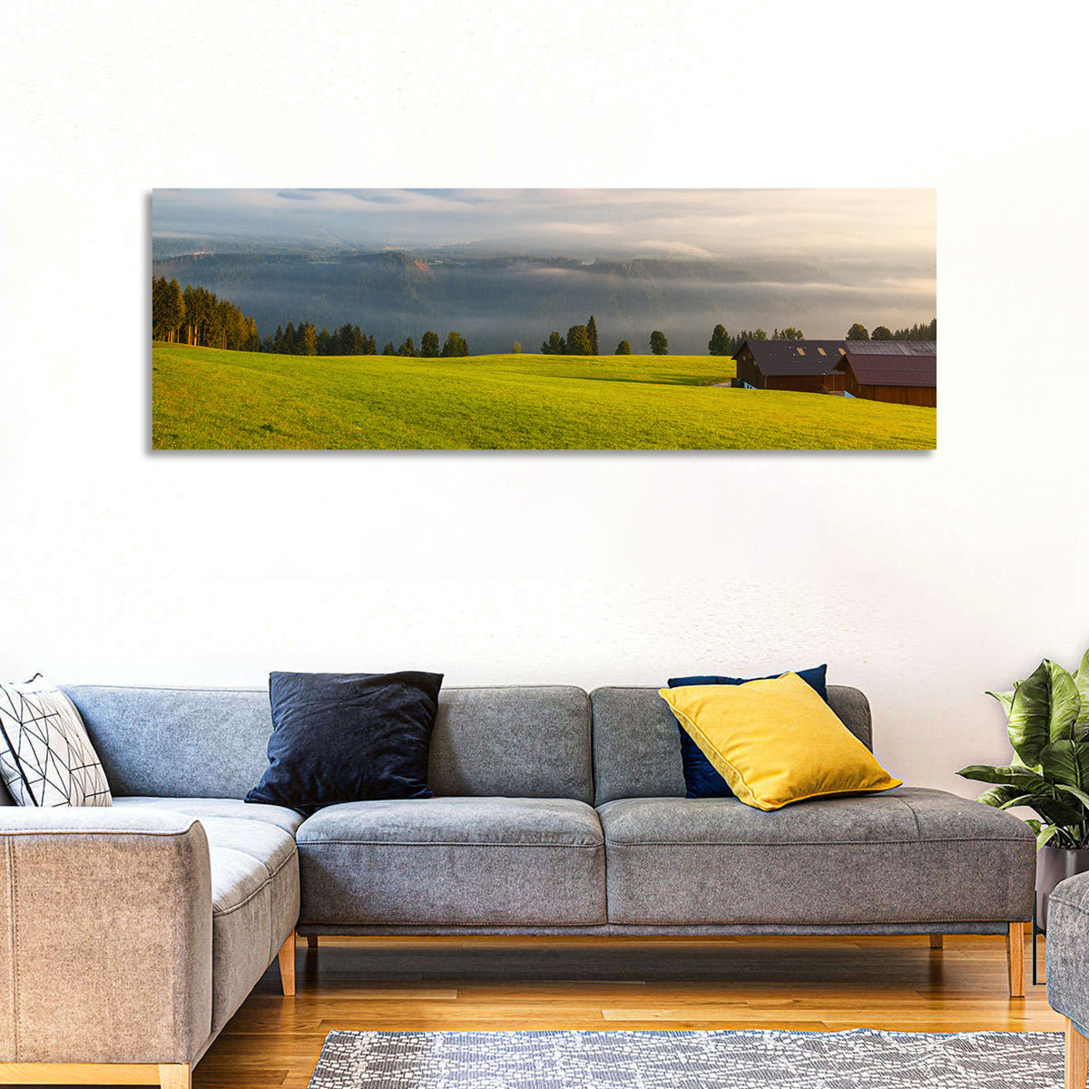 Sunlit Mountain Clouds Wall Art in a room, panoramic