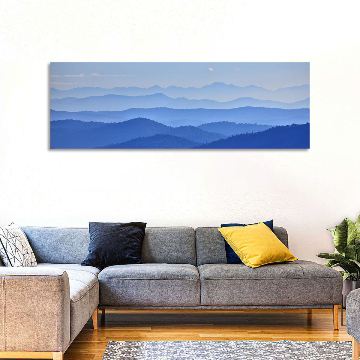 Misty Blue Mountain Valley Wall Art in a room, panoramic