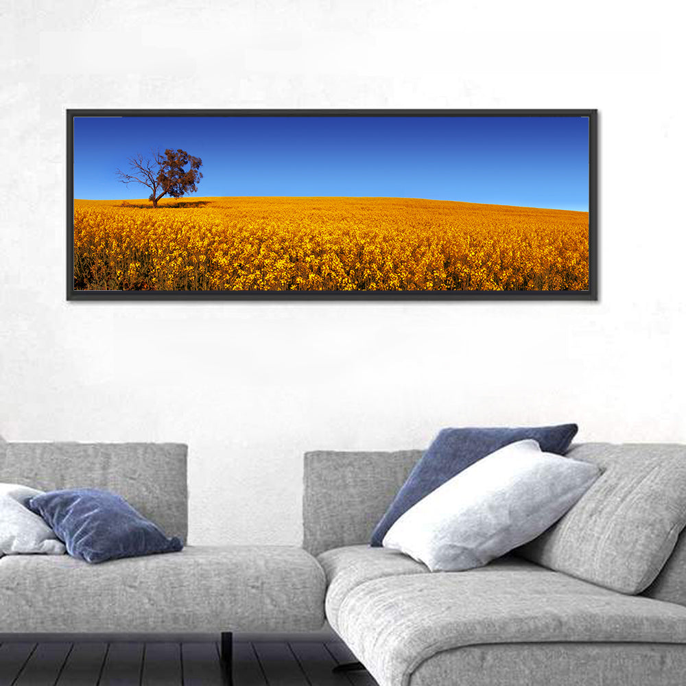 Canola Field with Lone Tree Wall Art in a room, panoramic