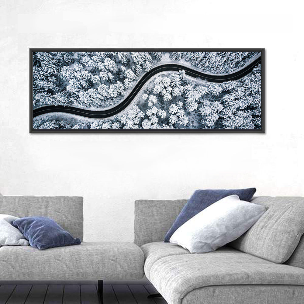 S-curve Winter Forest Road Wall Art in a room, panoramic