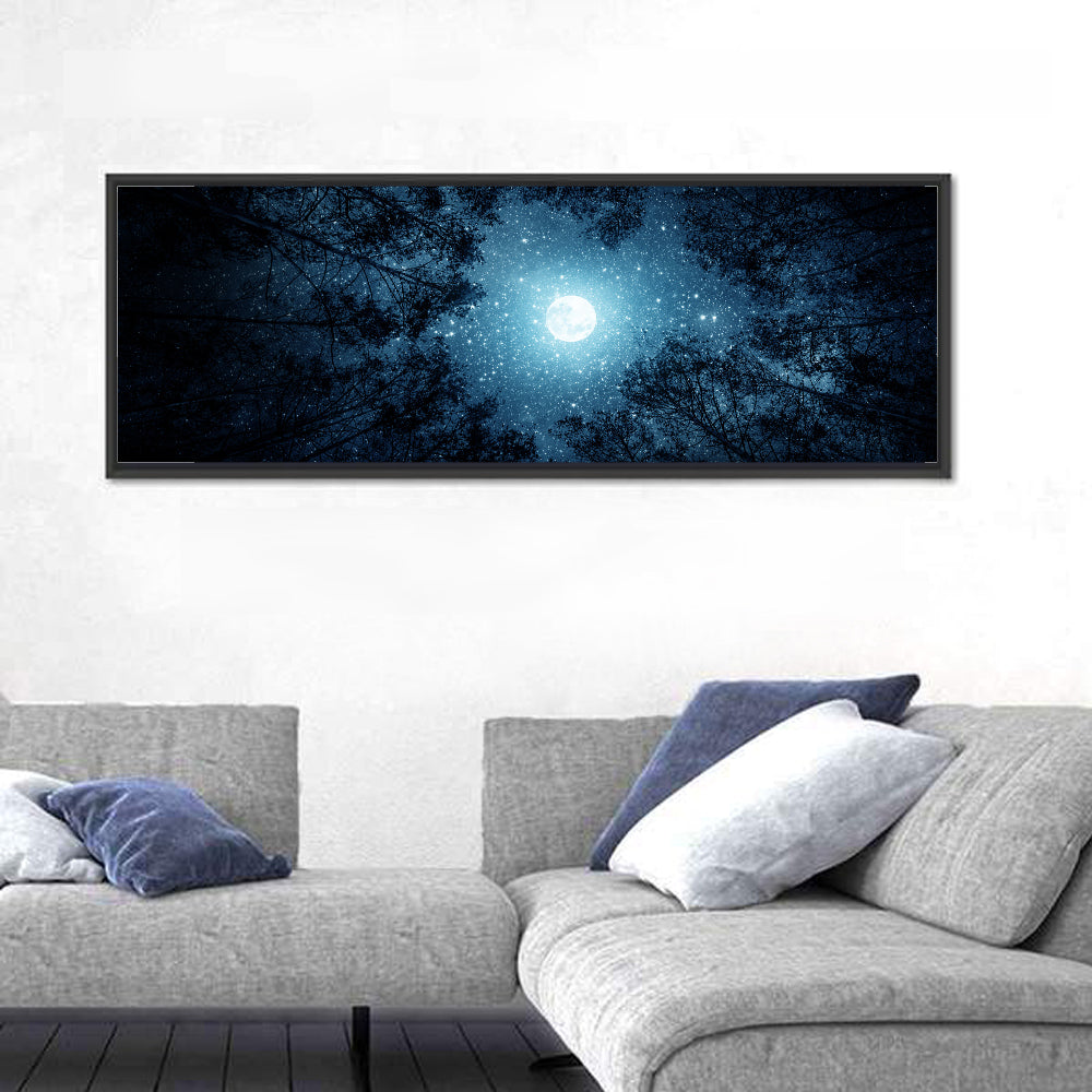 Full Moon Over Forest Wall Art in a room, panoramic