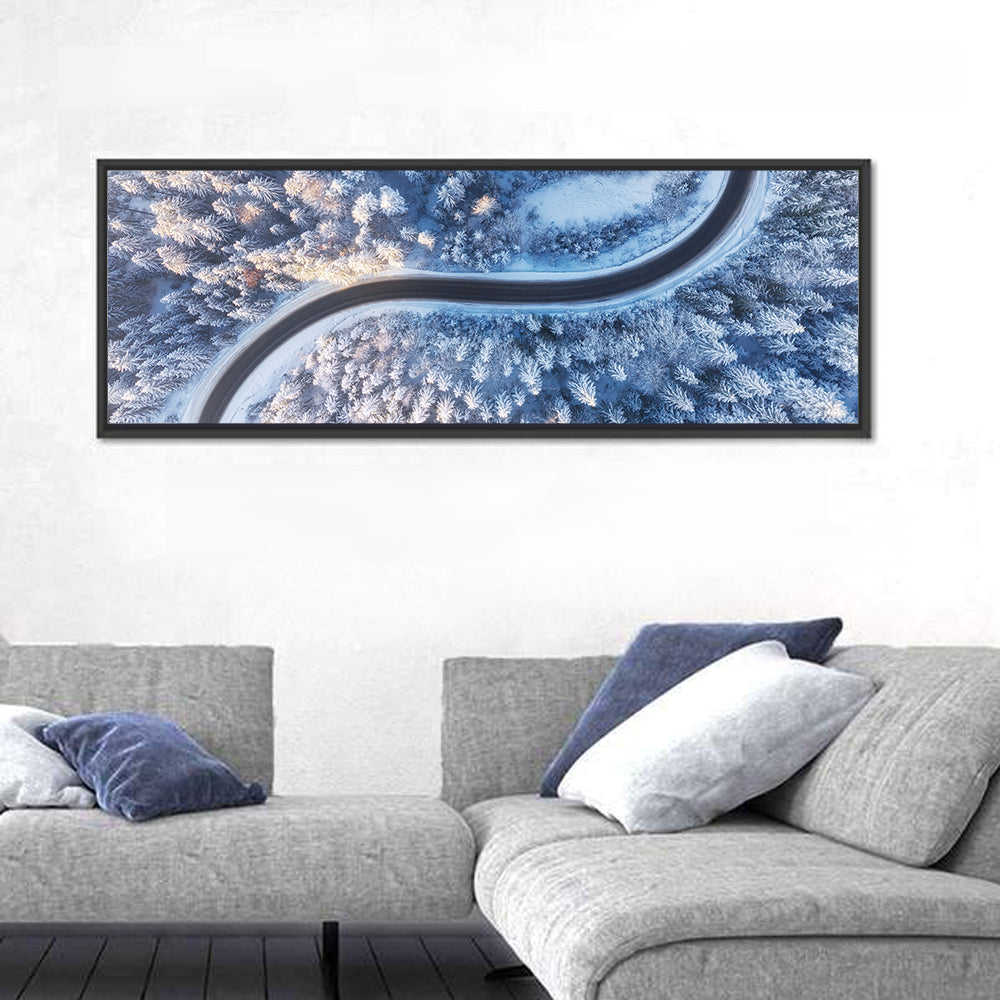 Winding Snow-covered Forest Road Wall Art in a room, panoramic