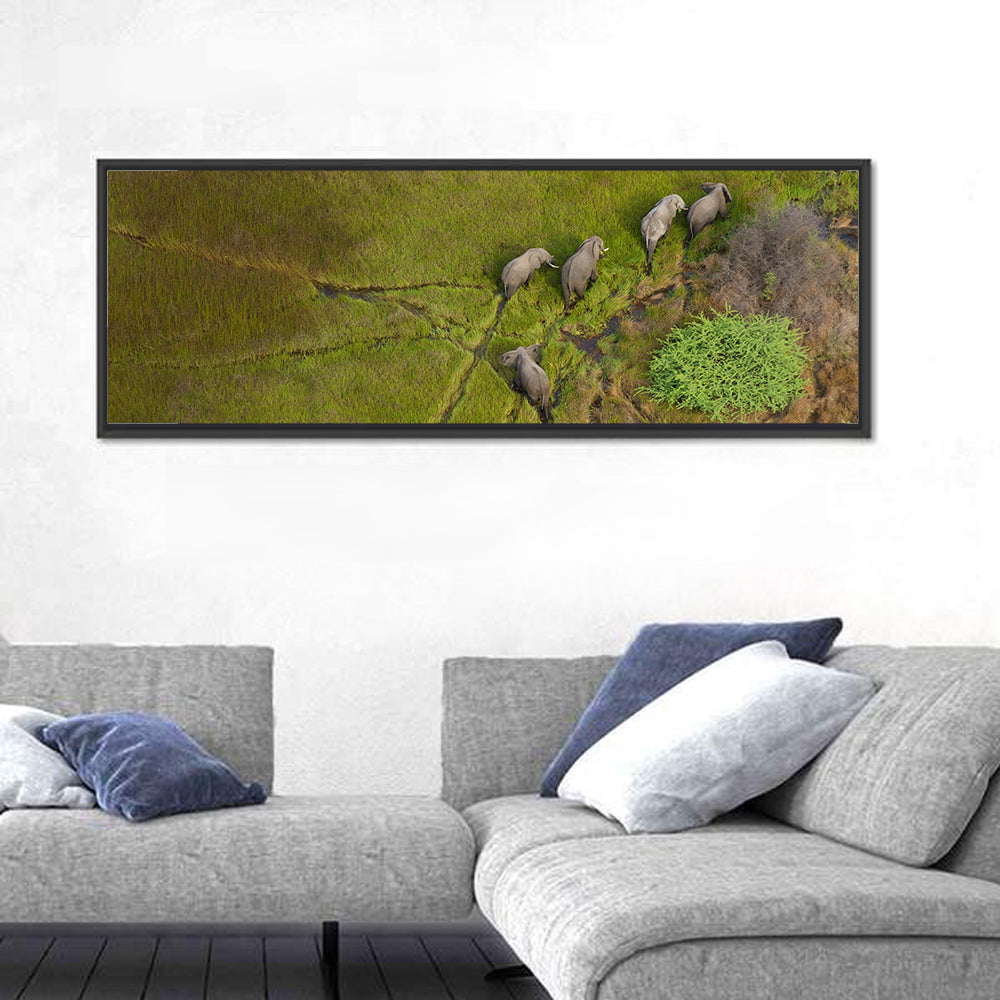 Aerial Herd of Elephants Wall Art in a room, panoramic