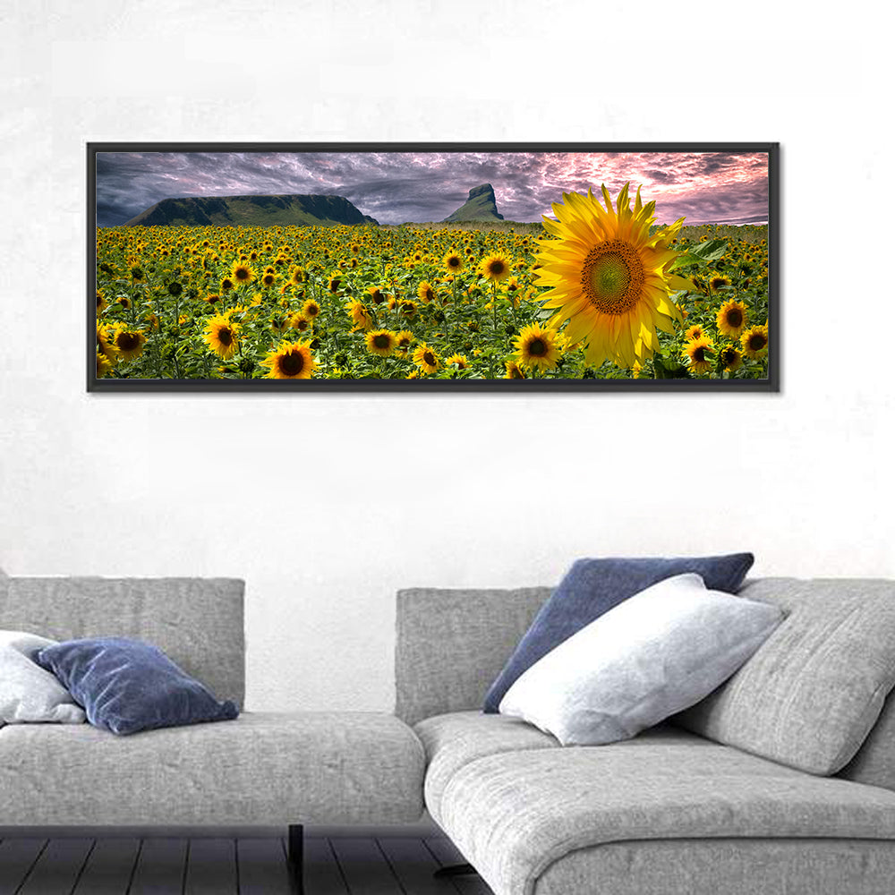 Sunflower Field with Mountains Wall Art in a room, panoramic
