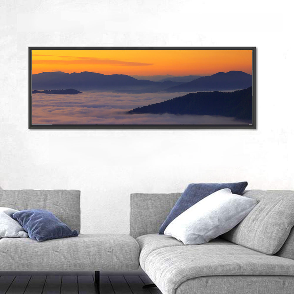 Cloud Sea Over Mountains at Golden Dawn Wall Art in a room, panoramic