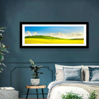 Rapeseed Field and Rolling Hills Under Blue Sky Wall Art
