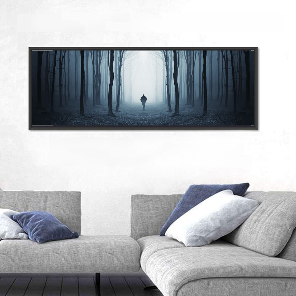 Lone Figure in Misty Forest Wall Art in a room, panoramic