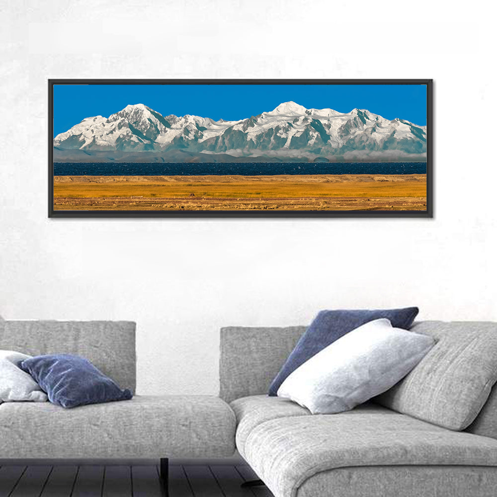 Snow-capped Peaks Over Lake Titicaca Wall Art in a room, panoramic