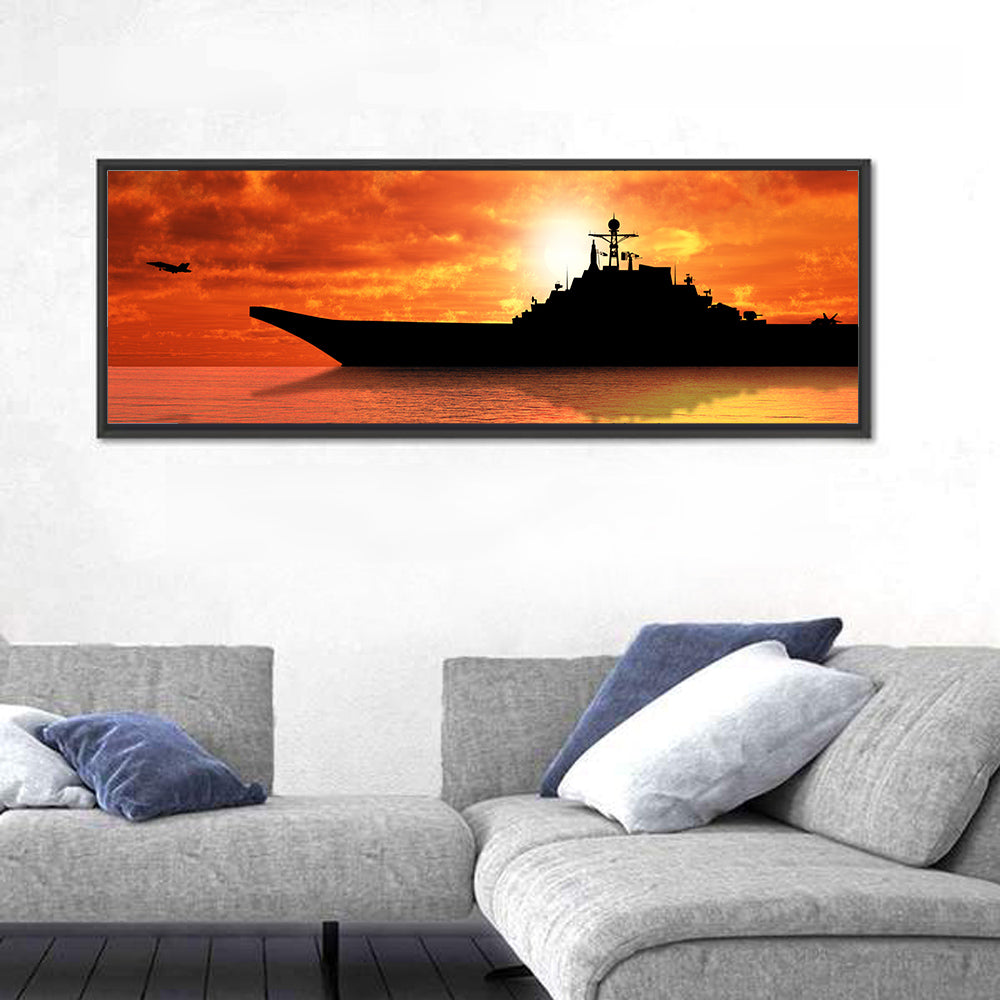 Sunset Aircraft Carrier Silhouette Wall Art in a room, panoramic