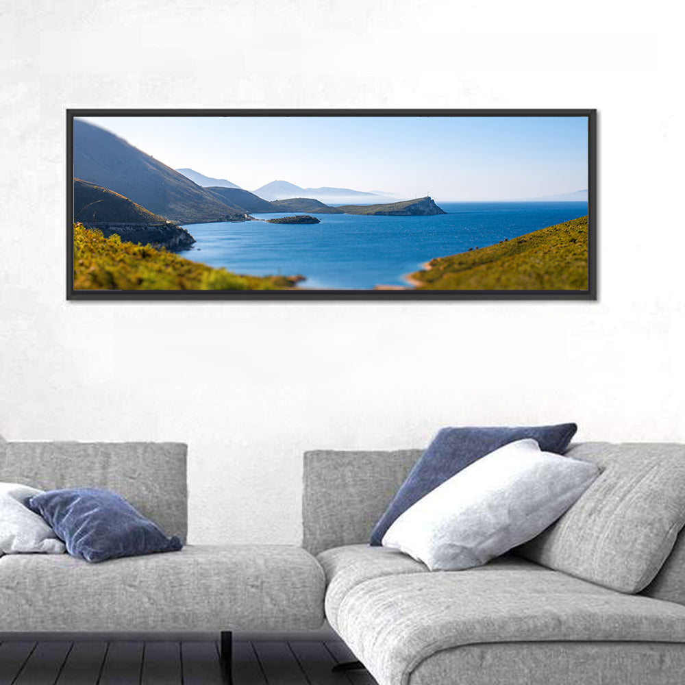 Coastal Cliffs and Lighthouse Bay Wall Art in a room, panoramic
