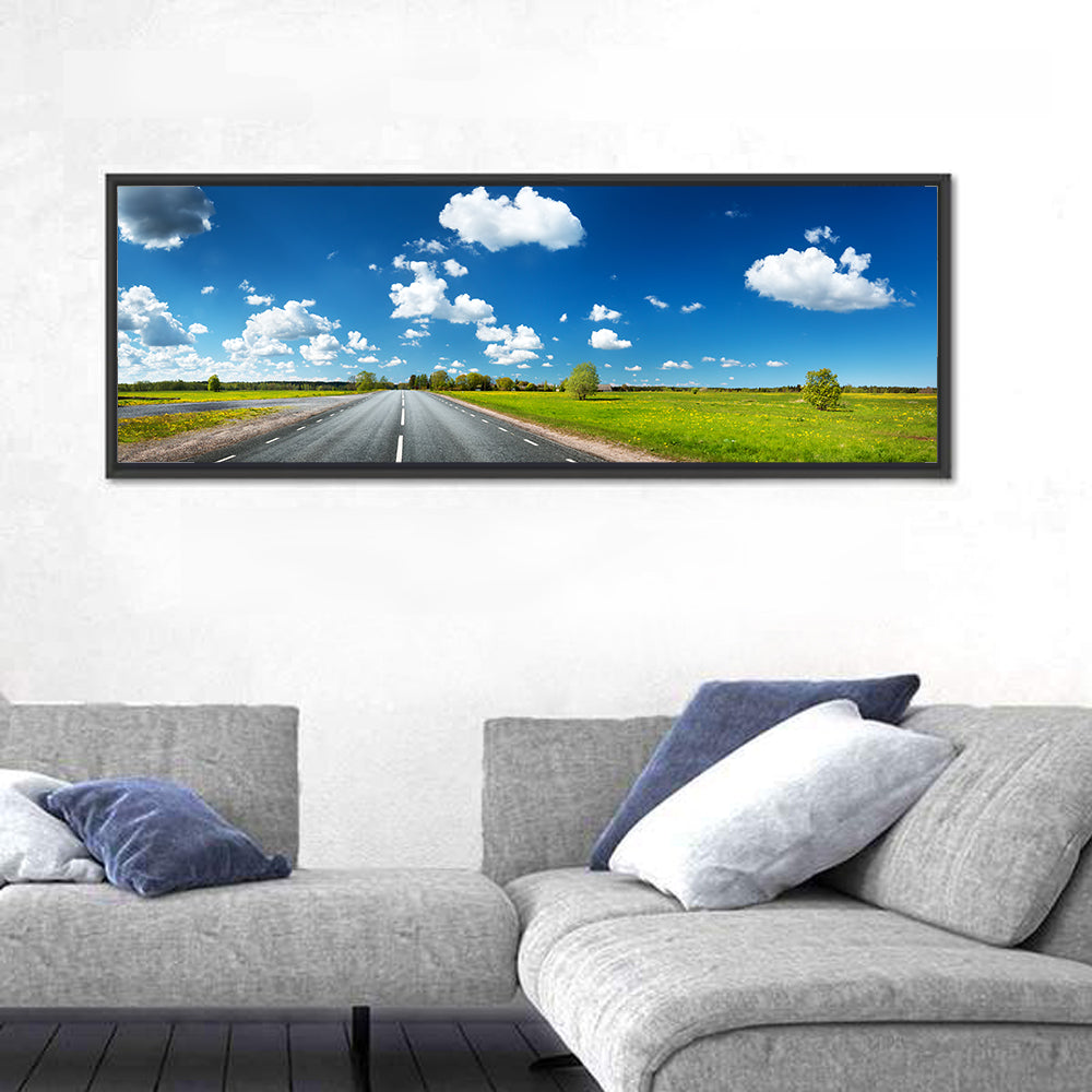 Asphalt Road Through Meadow Wall Art in a room, panoramic