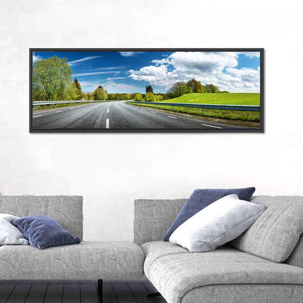 Sunlit Asphalt Road Wall Art in a room, panoramic