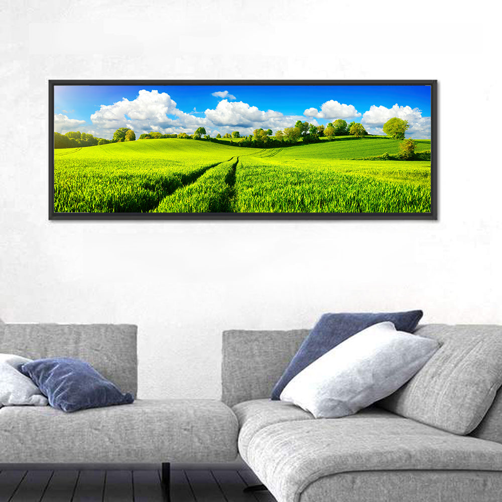 Tractor Tracks Through Green Rolling Hills Wall Art in a room, panoramic