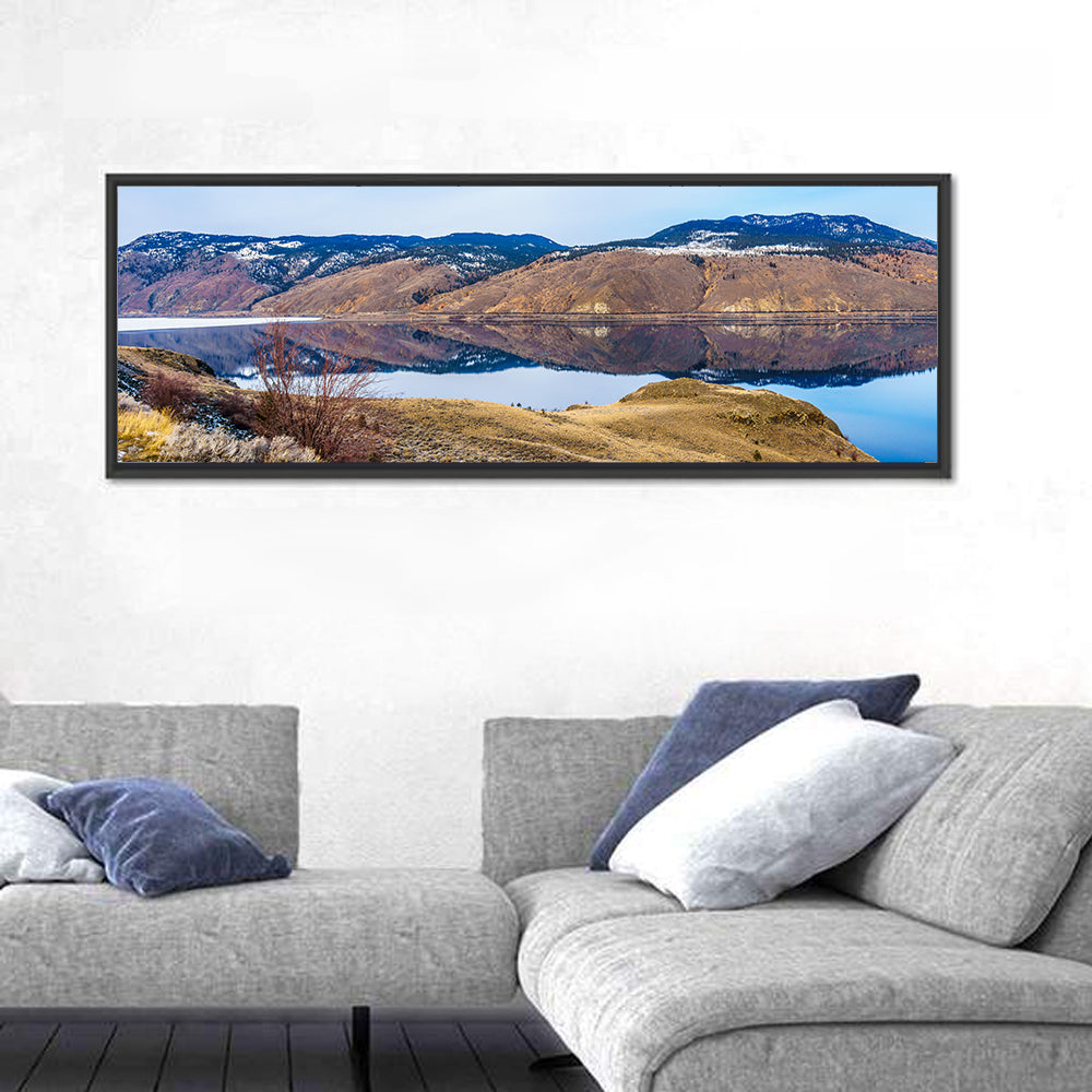 Kamloops Lake Mountain Reflection Wall Art in a room, panoramic