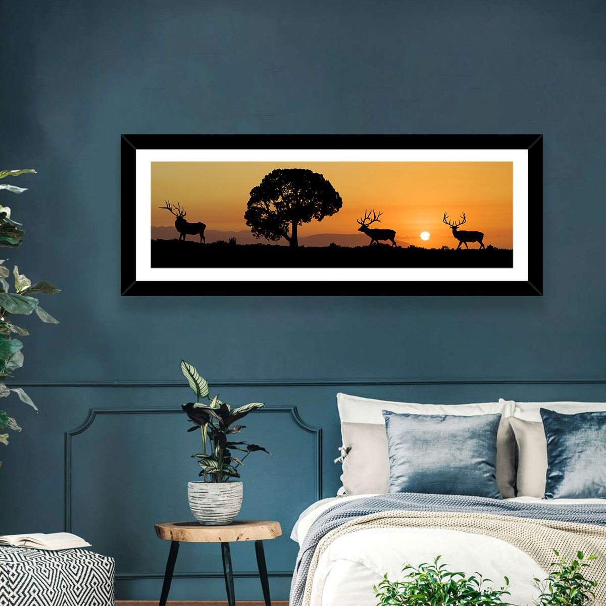 Bull Elk Sunset Silhouette Wall Art in a room, panoramic