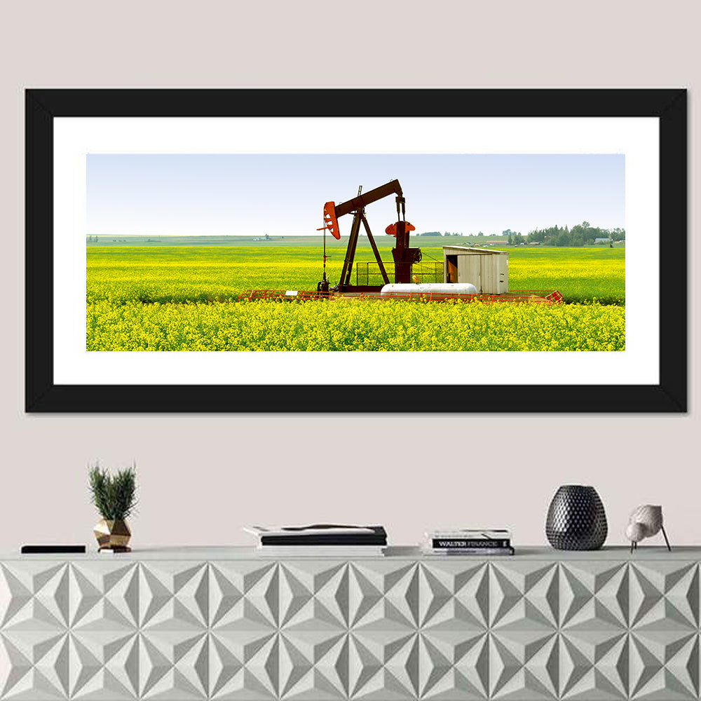Rusty Pumpjack in Yellow Canola Field Wall Art in a room, panoramic