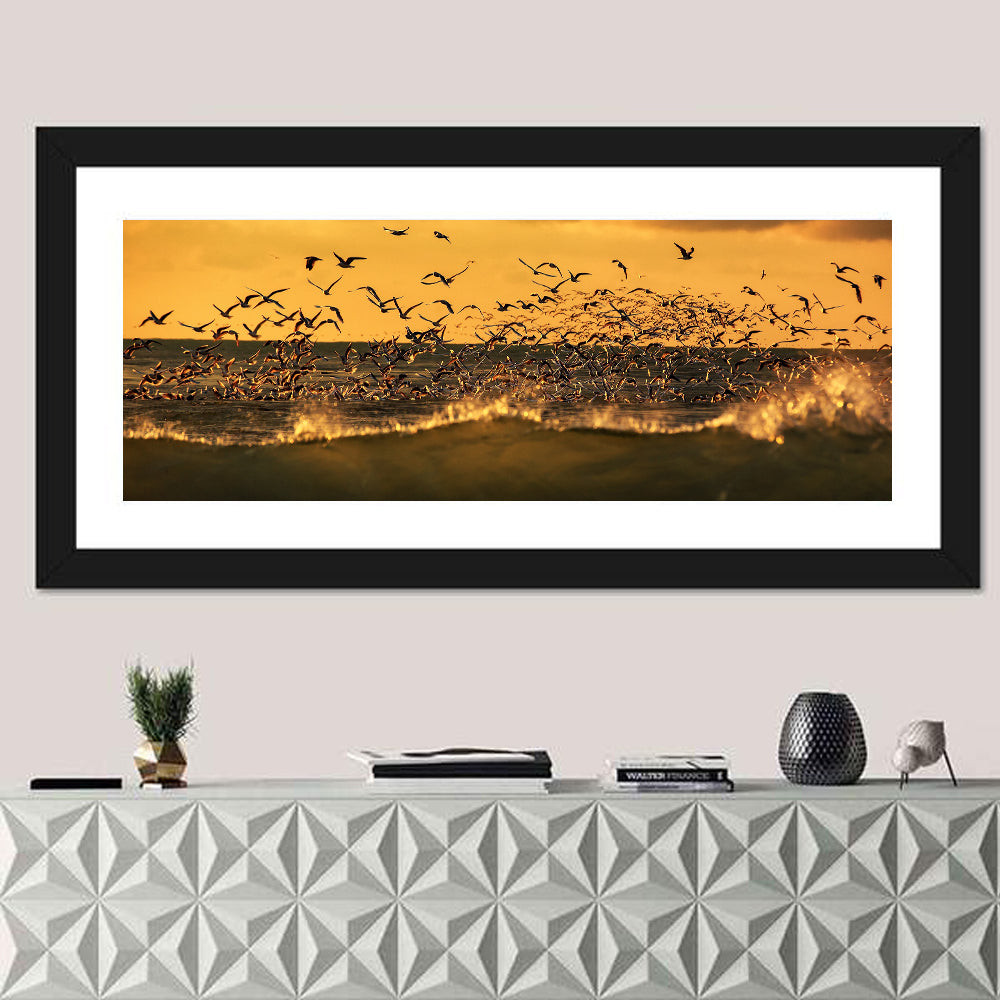 Seagull Flock at Golden Hour Wall Art in a room, panoramic