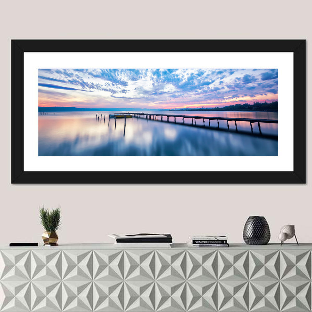 Cloudy Lake Pier at Dusk Wall Art in a room, panoramic