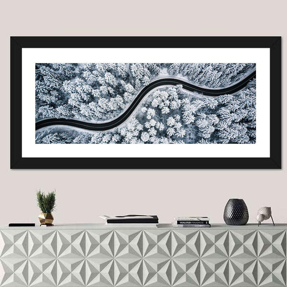 S-curve Winter Forest Road Wall Art in a room, panoramic