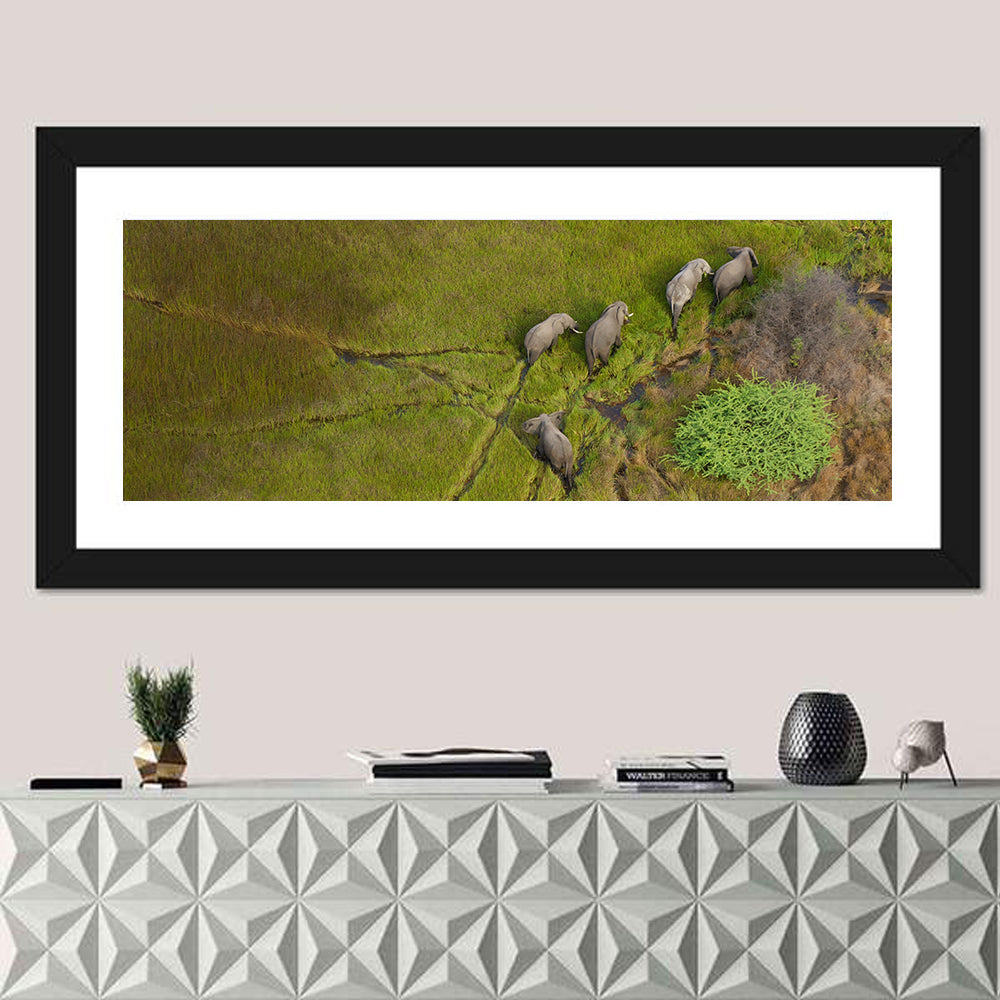 Aerial Herd of Elephants Wall Art in a room, panoramic
