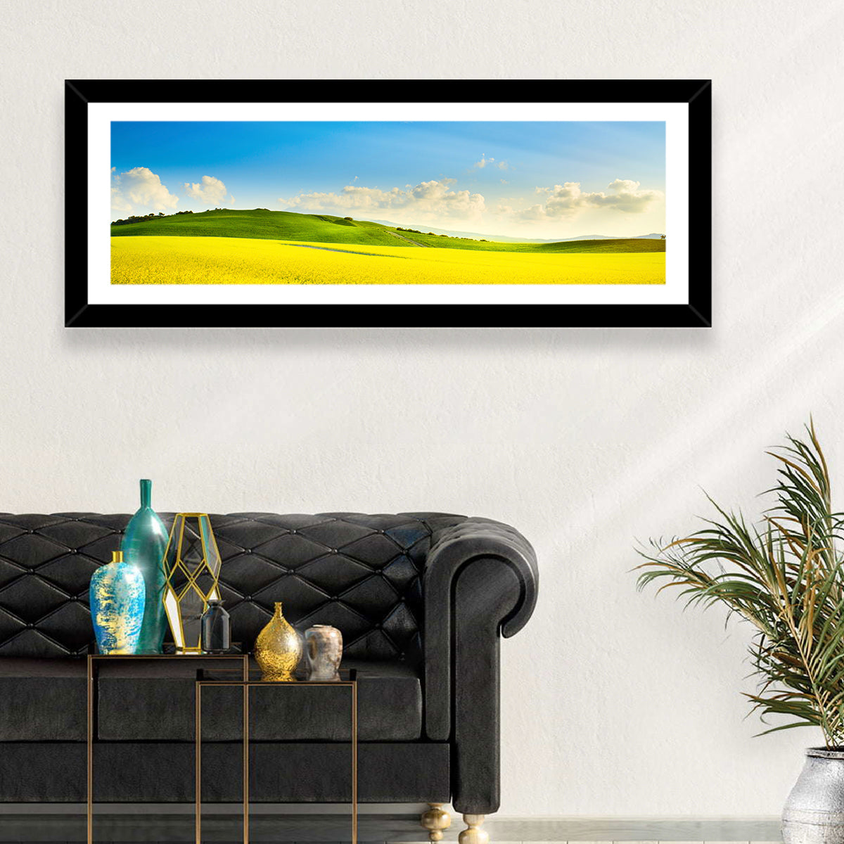 Rapeseed Field and Rolling Hills Under Blue Sky Wall Art in a room, panoramic