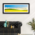 Rapeseed Field and Rolling Hills Under Blue Sky Wall Art